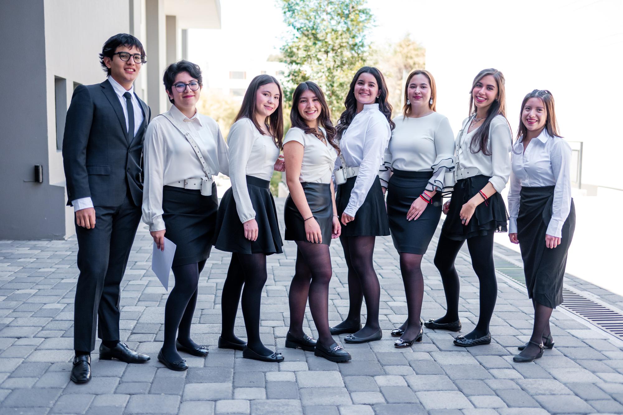 Senior students who have excelled throughout their academic careers honored the flag at the Jura de la Bandera on Sept. 28