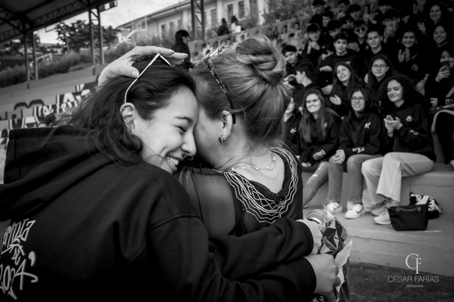 Teachers Valentina Serrano and Yanette Lantingua share of moment of embrace during the senior's hoody ceremony in September. 